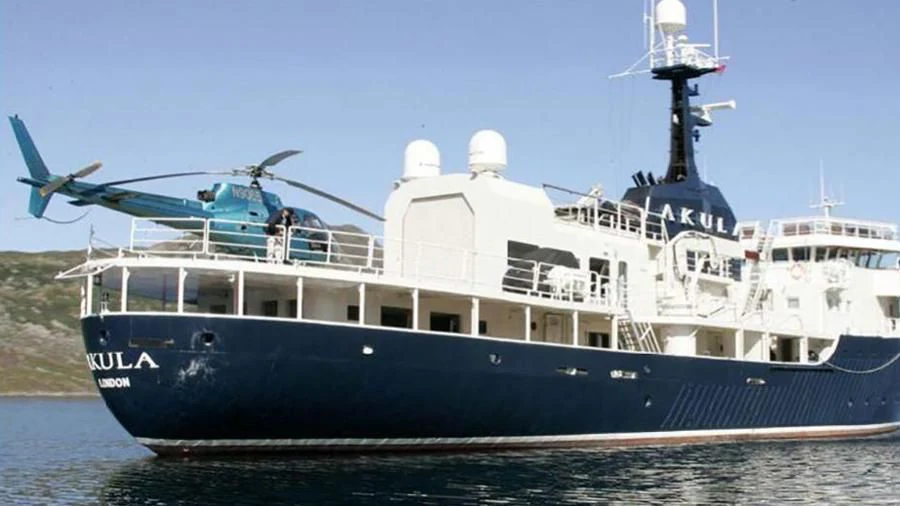 a large boat with a crane on top aboard OMNIA Yacht for Sale