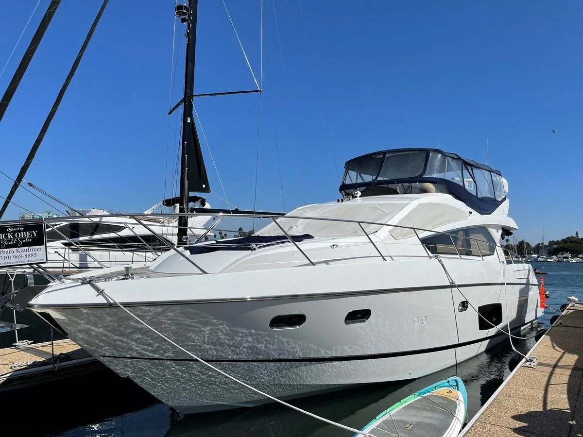 a white boat docked aboard GRACE ELLEN Yacht for Sale