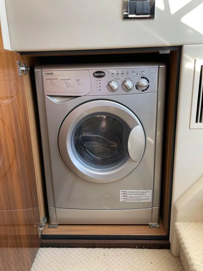 a washing machine in a room aboard GRACE ELLEN Yacht for Sale