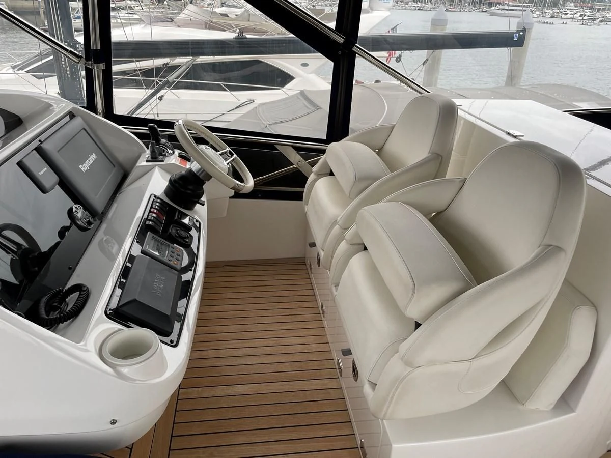 a white car on a wooden deck aboard GRACE ELLEN Yacht for Sale