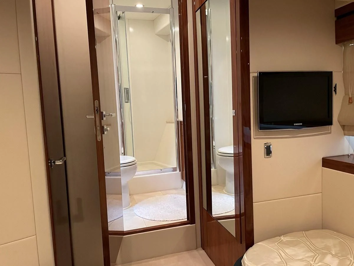 a bathroom with a large glass shower aboard GRACE ELLEN Yacht for Sale