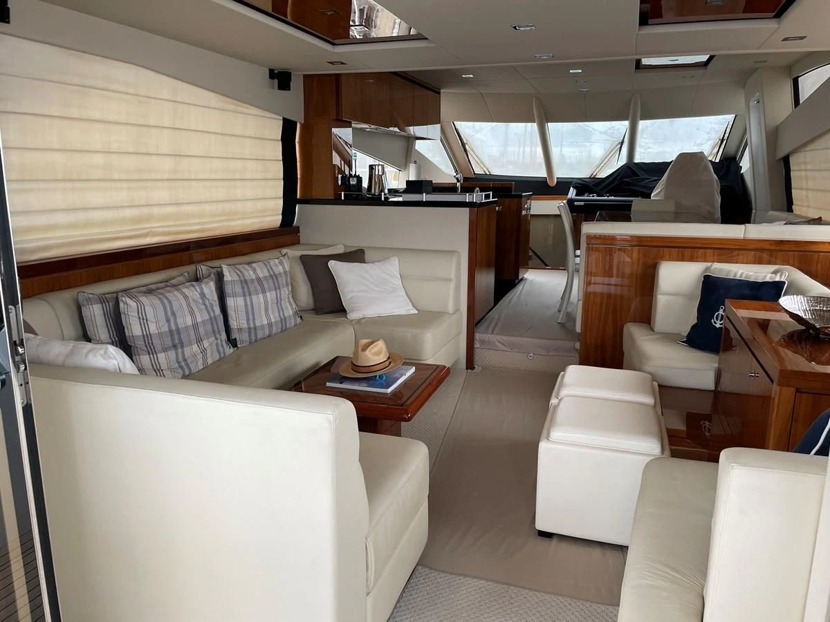 a train car with a couch and a coffee table aboard GRACE ELLEN Yacht for Sale