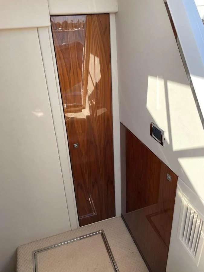 a wooden door with a mirror above it aboard GRACE ELLEN Yacht for Sale
