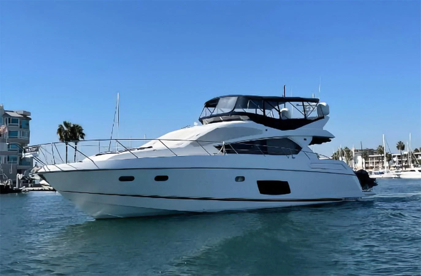 a white yacht in the water aboard GRACE ELLEN Yacht for Sale