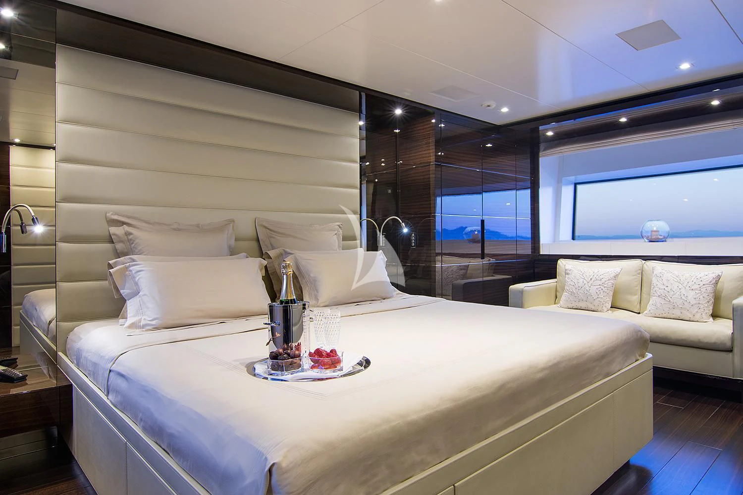a bed with a white bed spread aboard SOURAYA Yacht for Sale