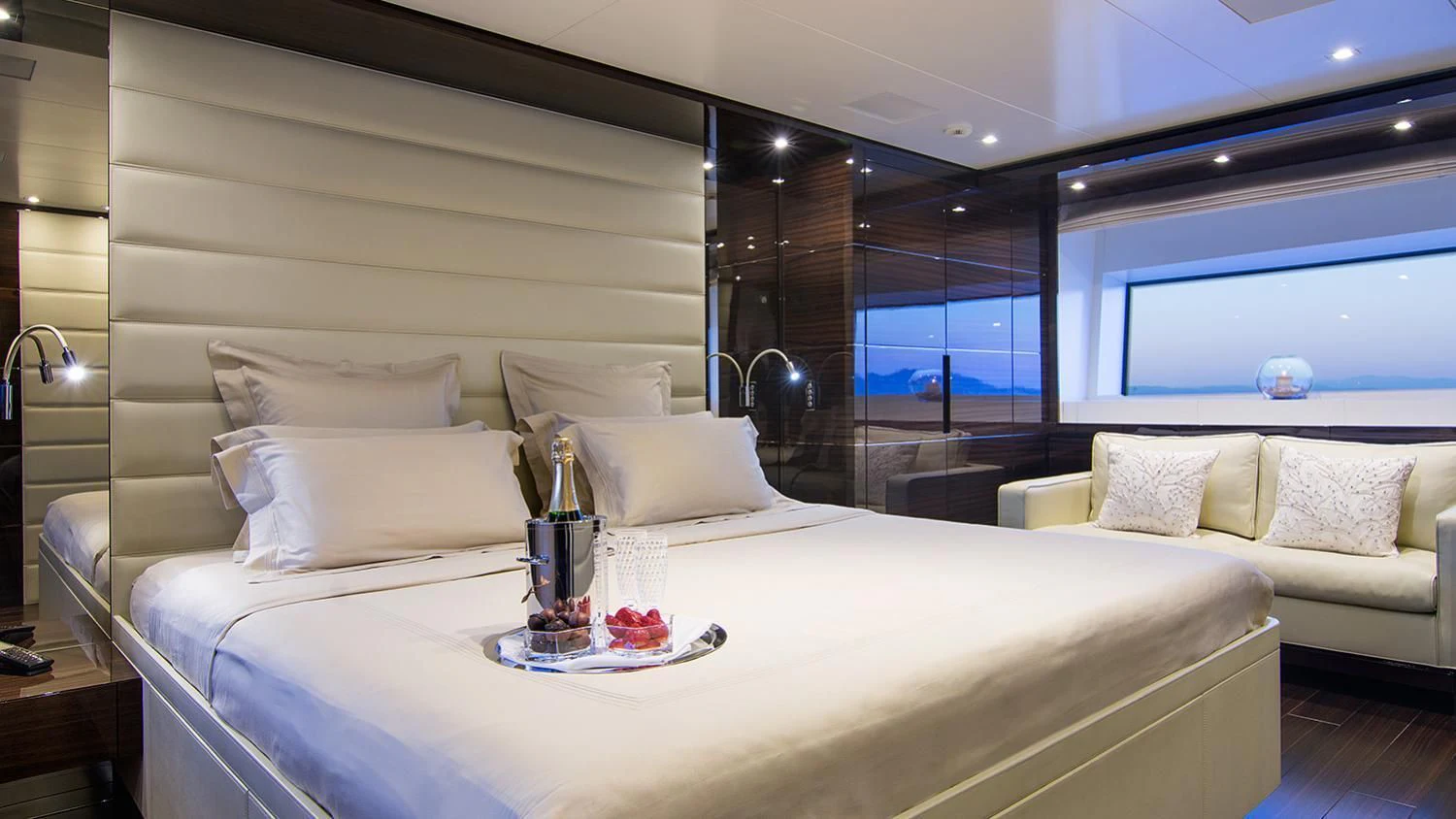 a bed with white sheets and pillows aboard SOURAYA Yacht for Sale