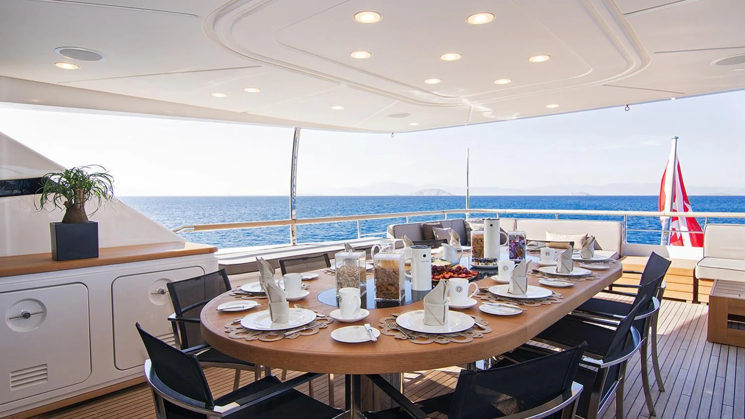 a large table with plates and chairs aboard SOURAYA Yacht for Sale
