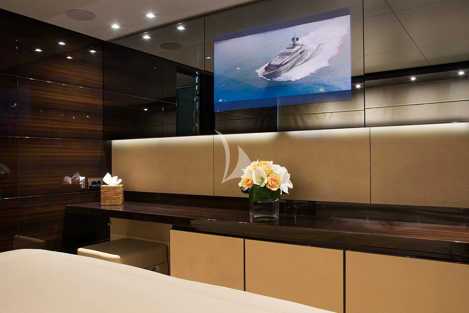 a glass vase with white flowers on a counter aboard SOURAYA Yacht for Sale