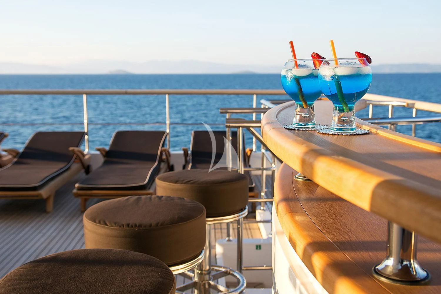 a table with chairs and a glass on it aboard SOURAYA Yacht for Sale