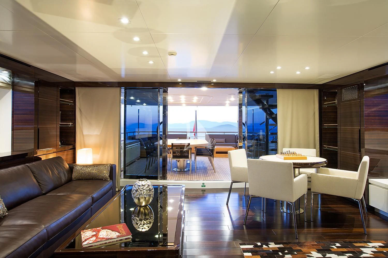 a living room with a large window aboard SOURAYA Yacht for Sale