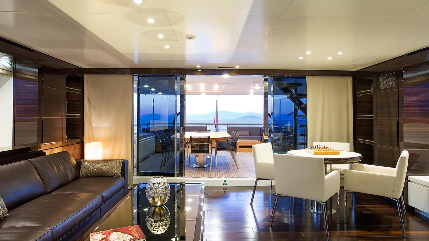 a living room with a large window aboard SOURAYA Yacht for Sale