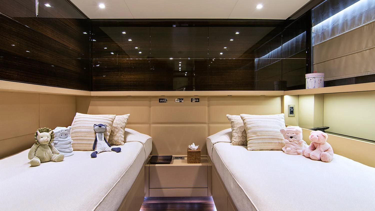 a room with a bed and stuffed animals aboard SOURAYA Yacht for Sale