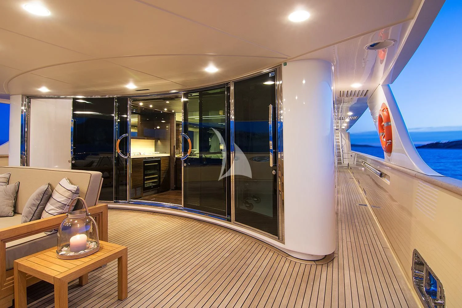 a room with a large glass door and a table with a glass window aboard SOURAYA Yacht for Sale