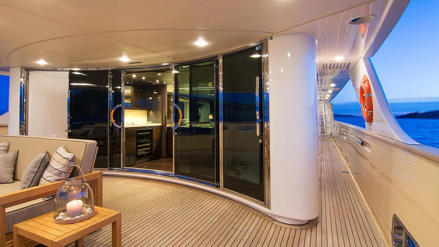 a room with a large glass door and a table with a glass window aboard SOURAYA Yacht for Sale
