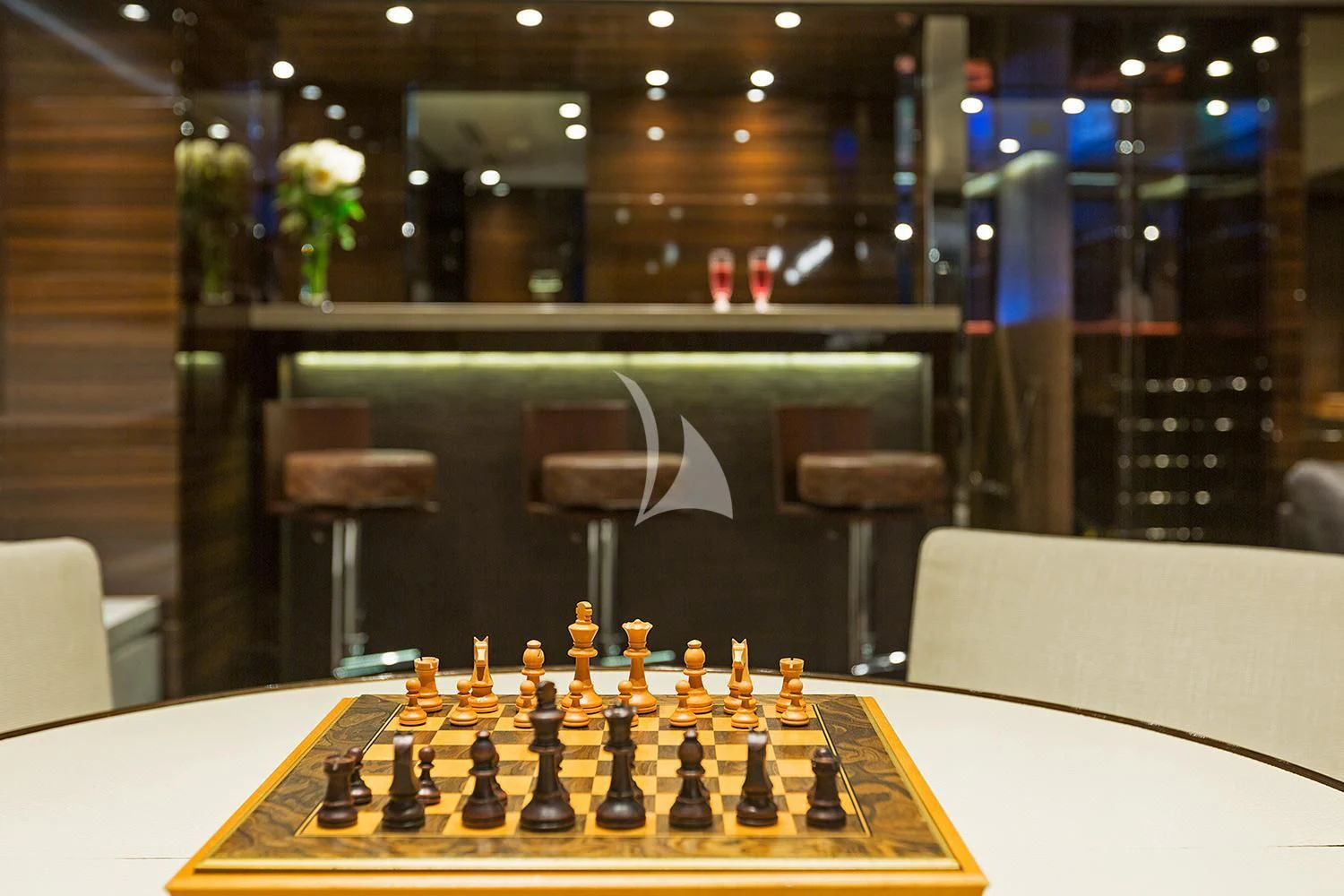 a chess board with a chair and a table with chairs aboard SOURAYA Yacht for Sale