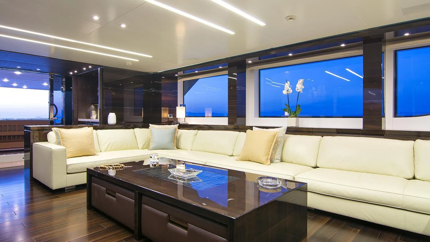 a living room with a large screen aboard SOURAYA Yacht for Sale