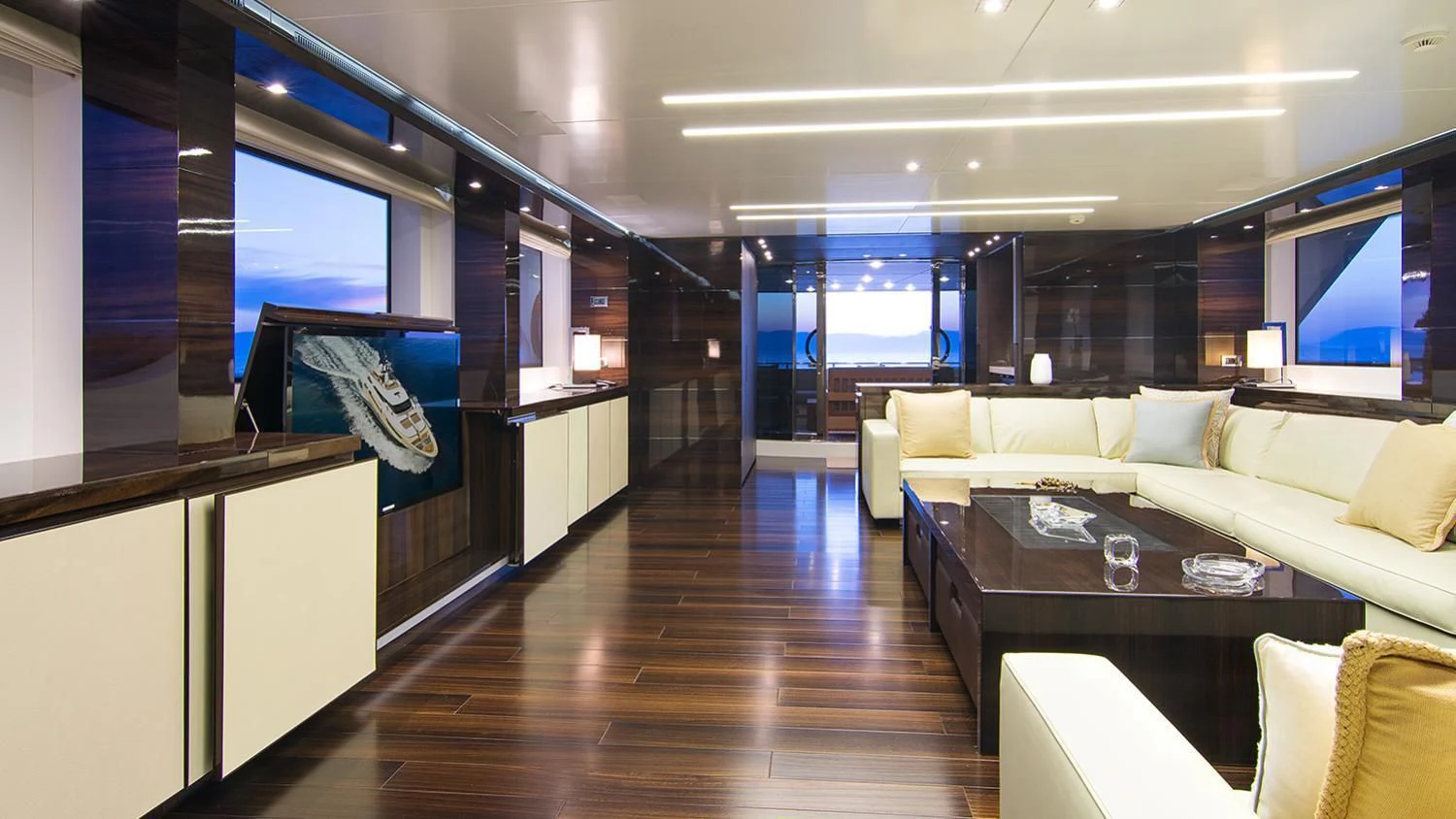 a room with a table and couches aboard SOURAYA Yacht for Sale