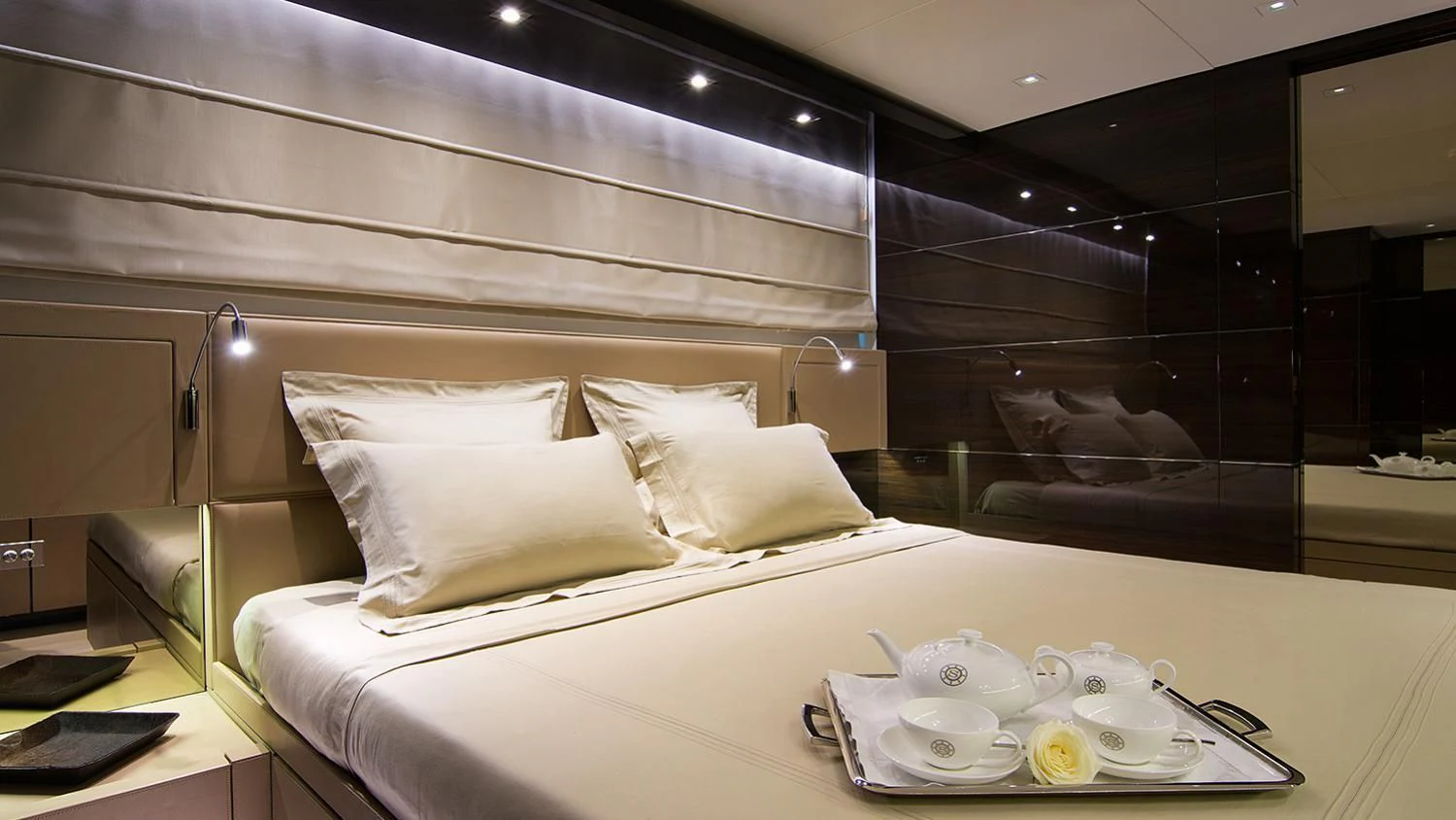 a bed with white sheets and pillows aboard SOURAYA Yacht for Sale