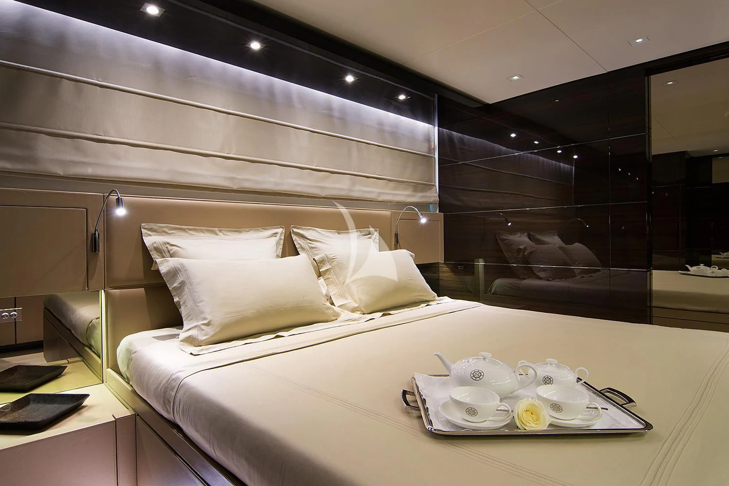 a bed with white sheets and pillows aboard SOURAYA Yacht for Sale