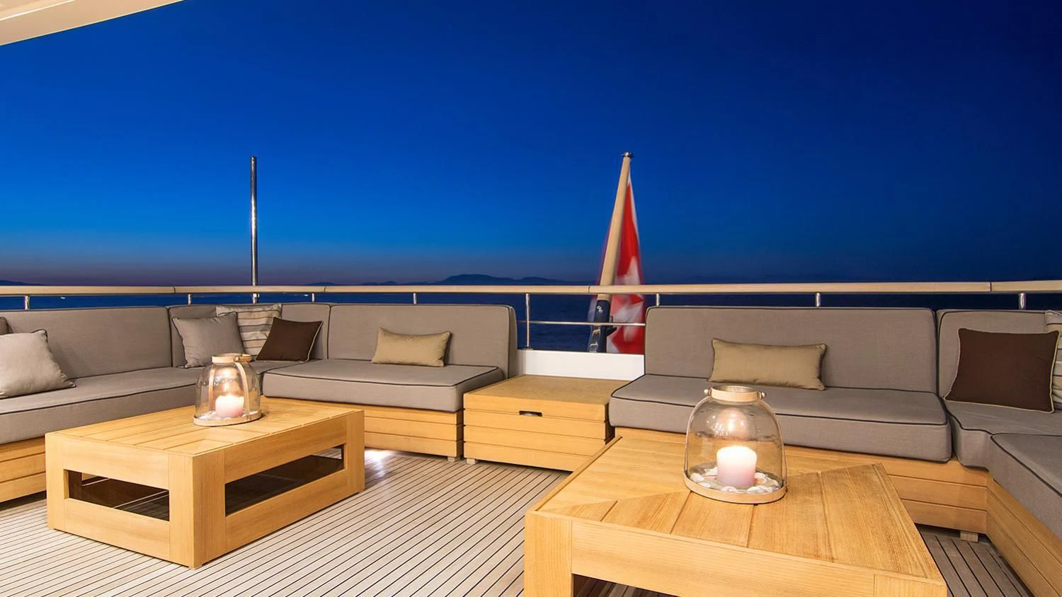 a room with a couch and a table and a lamp on a table aboard SOURAYA Yacht for Sale
