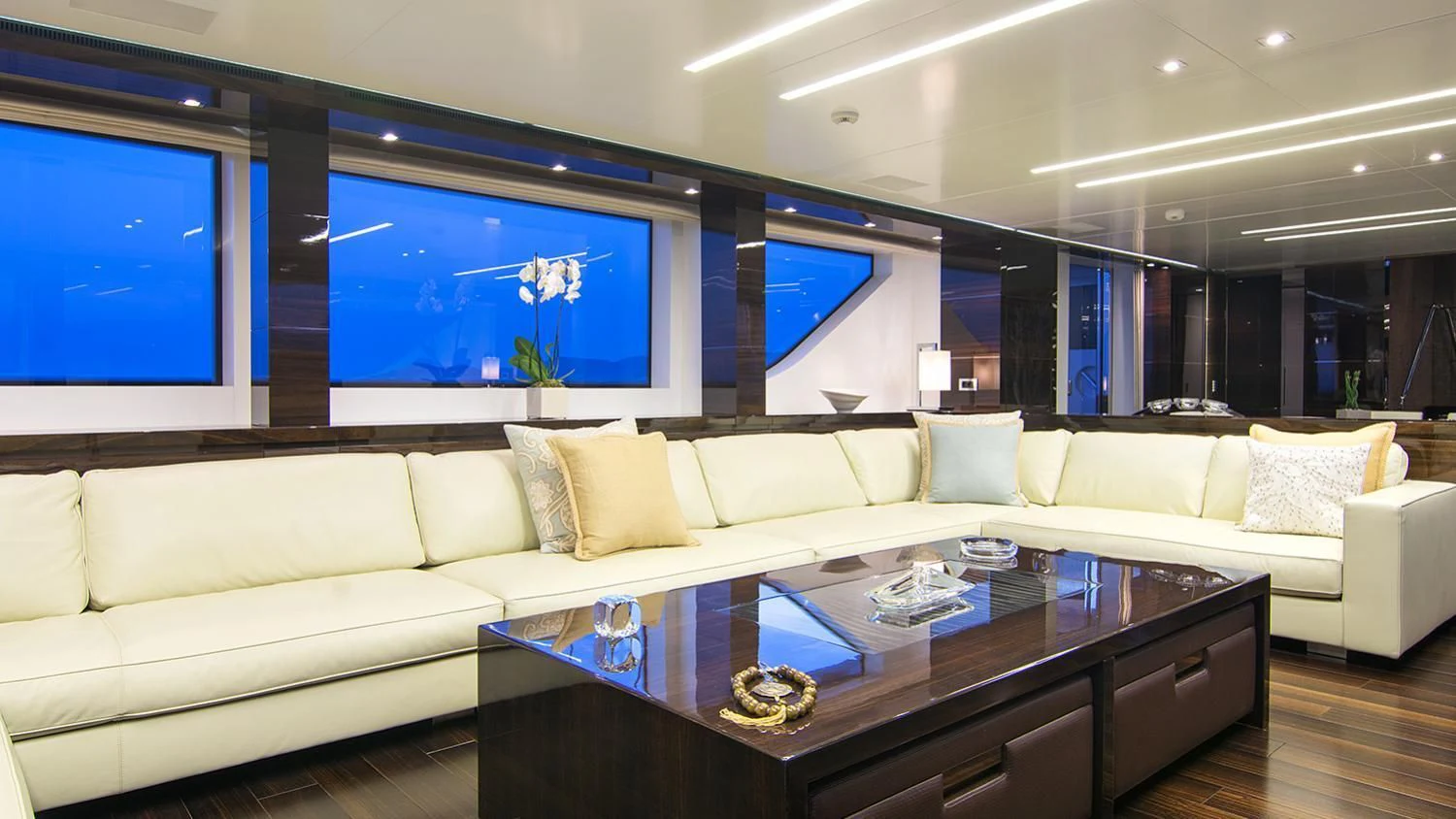 a living room with a large screen aboard SOURAYA Yacht for Sale