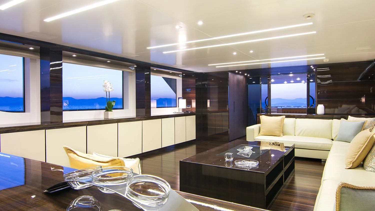 a living room with a large window aboard SOURAYA Yacht for Sale
