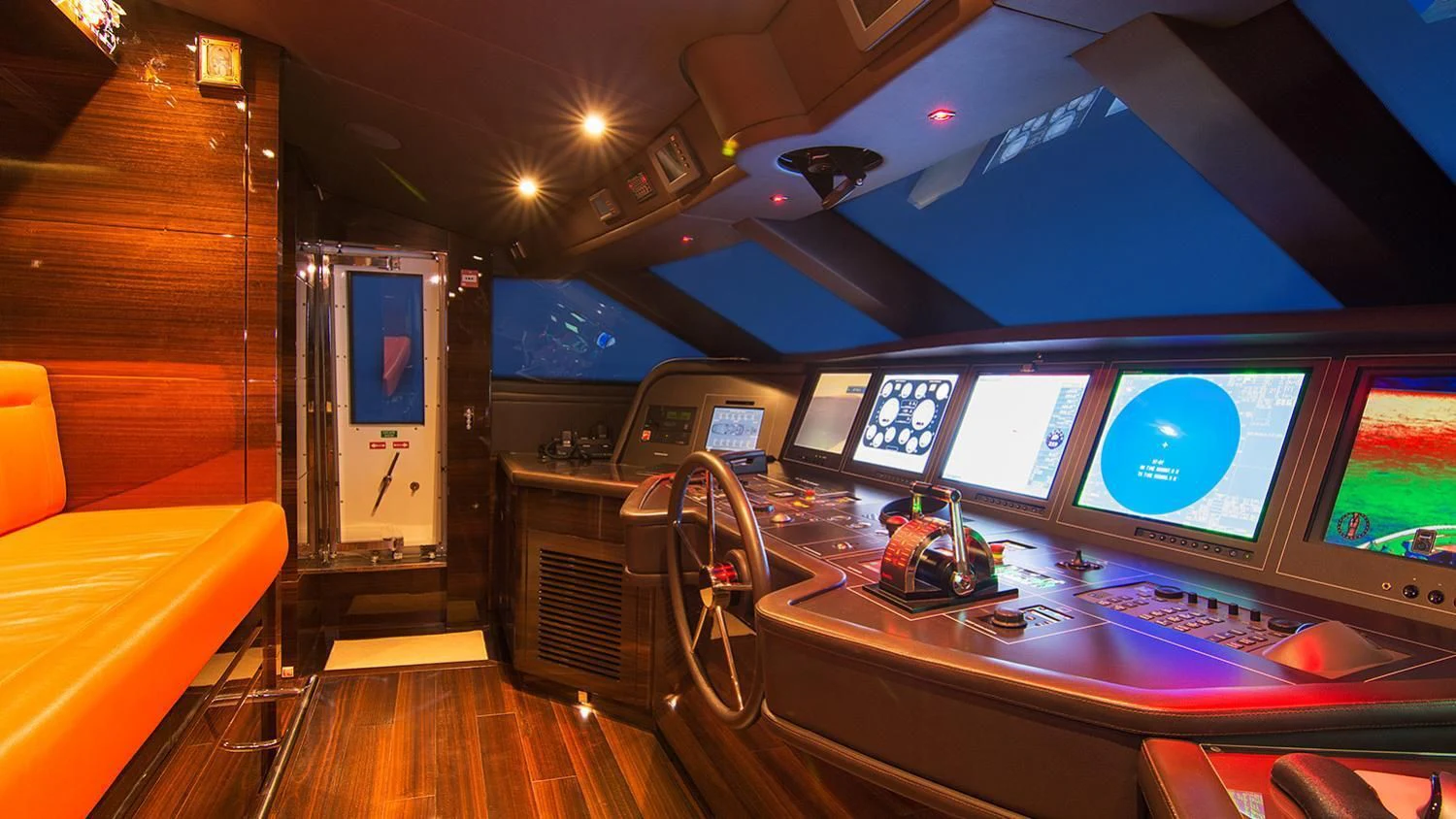 a room with a table and monitors aboard SOURAYA Yacht for Sale
