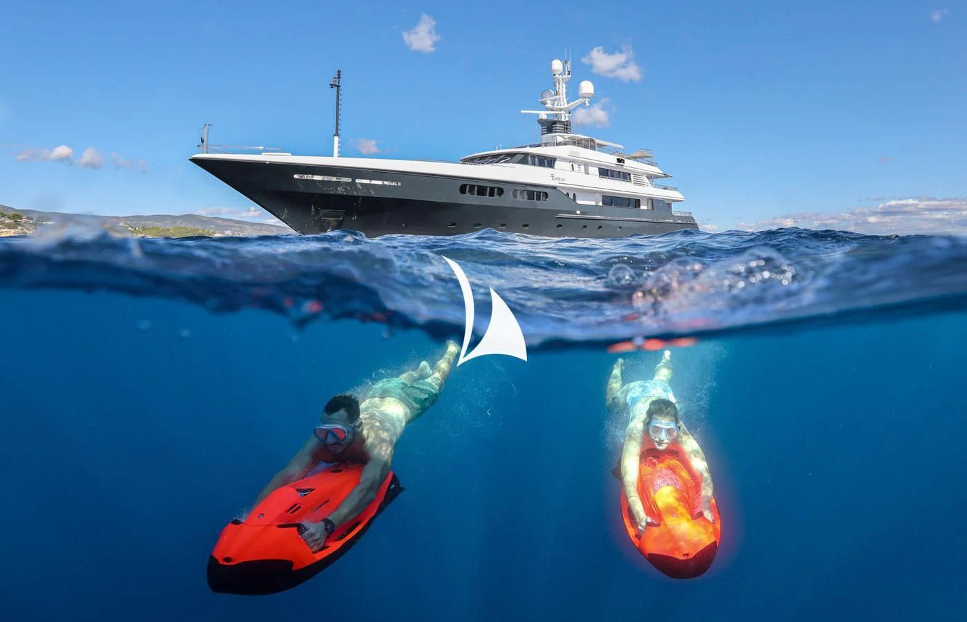 a boat and a couple of people in a kayak in the water aboard EMERALD (YET) Yacht for Sale