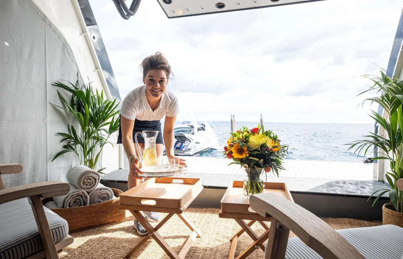 a person holding a glass of juice aboard EMERALD (YET) Yacht for Sale
