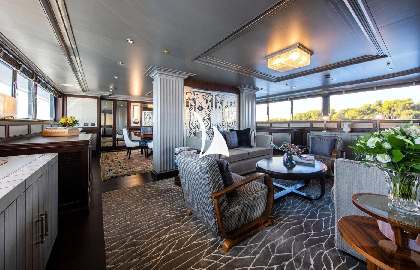 a living room with a couch and a table aboard EMERALD (YET) Yacht for Sale