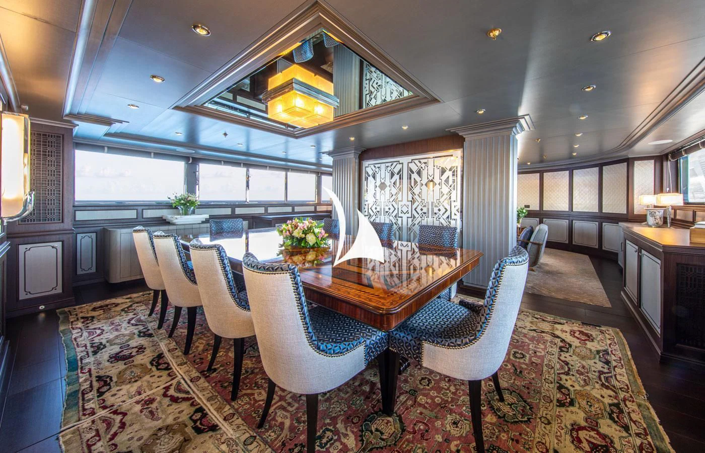 a room with a table chairs and a large window aboard EMERALD (YET) Yacht for Sale