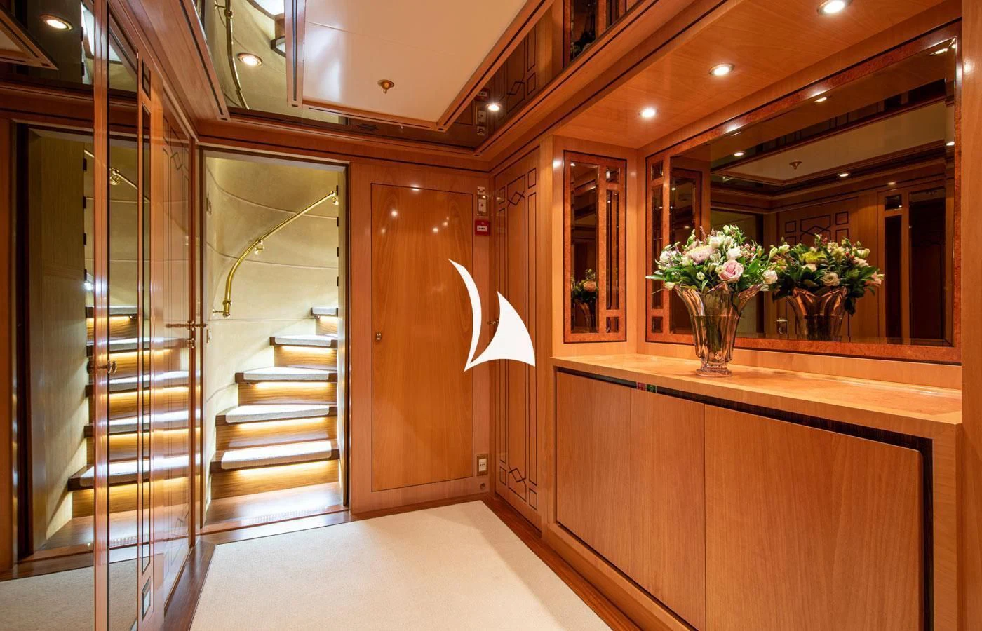 a room with a glass door and a glass case with flowers in it aboard EMERALD (YET) Yacht for Sale