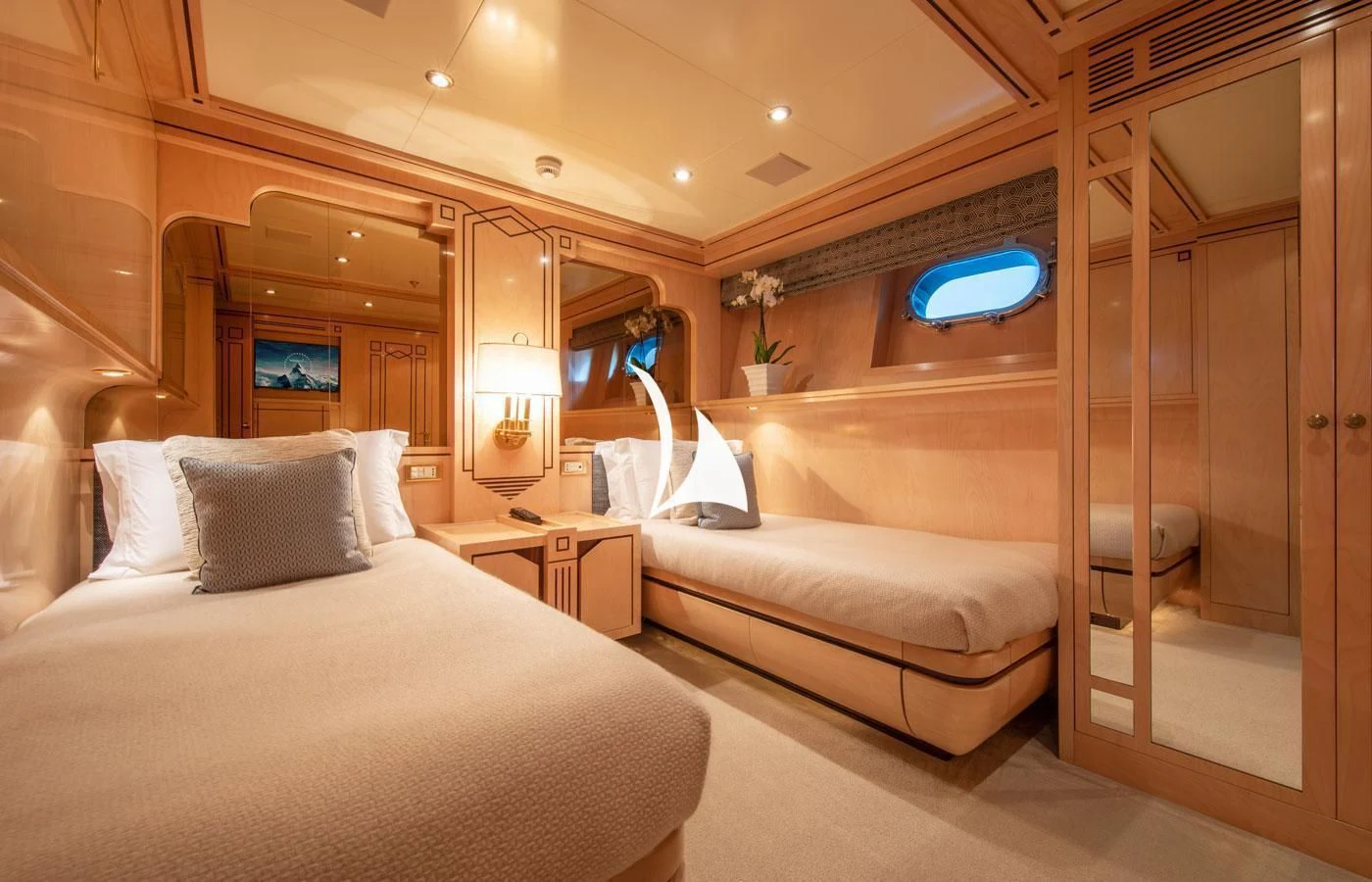 a room with a bed and a mirror aboard EMERALD (YET) Yacht for Sale