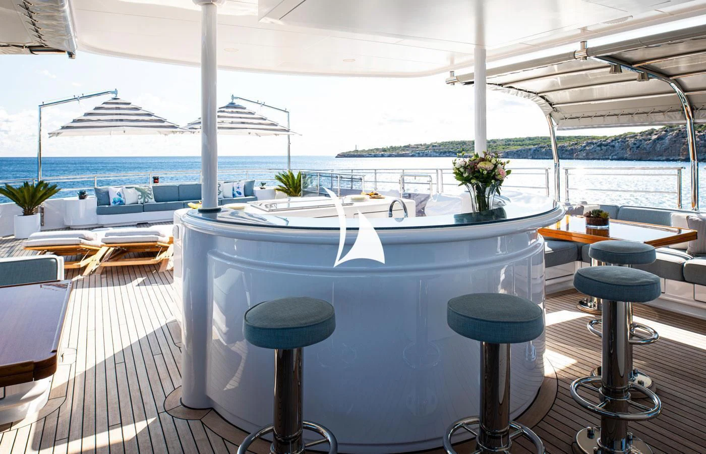 a table with stools and chairs on it aboard EMERALD (YET) Yacht for Sale