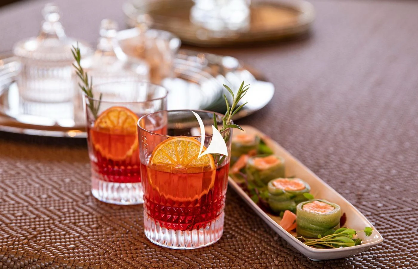 a group of glasses with drinks on a table aboard EMERALD (YET) Yacht for Sale