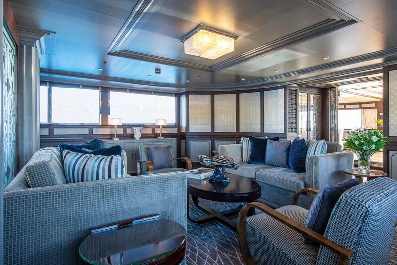 a living room with couches and a table aboard EMERALD (YET) Yacht for Sale