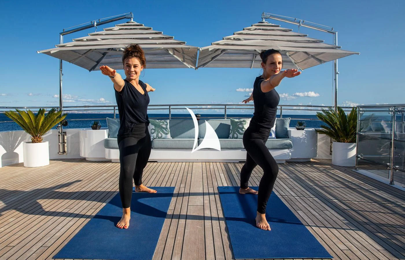 two women standing on a deck aboard EMERALD (YET) Yacht for Sale