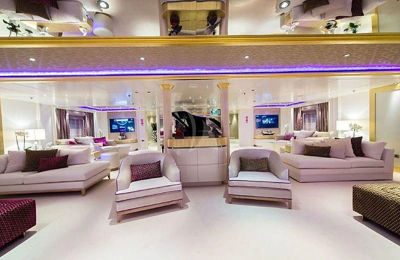a large room with couches and a tv aboard ELEGANT 007 Yacht for Sale
