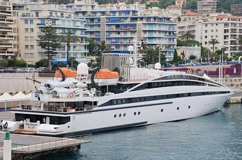 a large white boat in a harbor aboard ELEGANT 007 Yacht for Sale