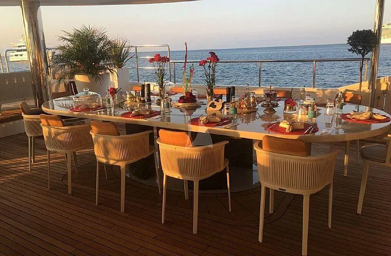 a table set with food and drinks aboard ELEGANT 007 Yacht for Sale