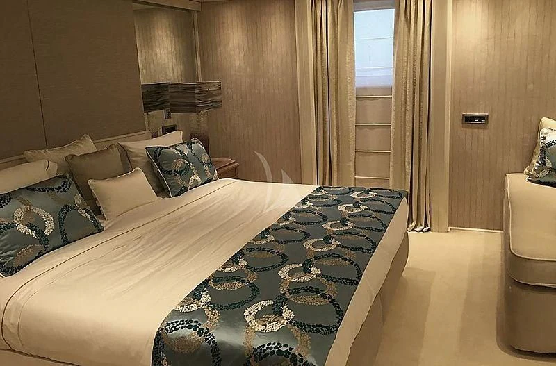 a bed with pillows and pillows aboard ELEGANT 007 Yacht for Sale