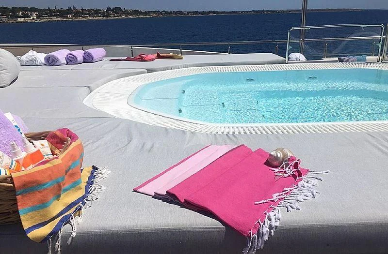 a pool with a towel and a towel on it aboard ELEGANT 007 Yacht for Sale