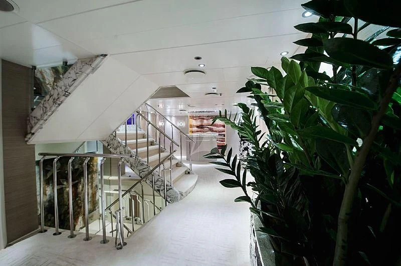 a long hallway with plants aboard ELEGANT 007 Yacht for Sale