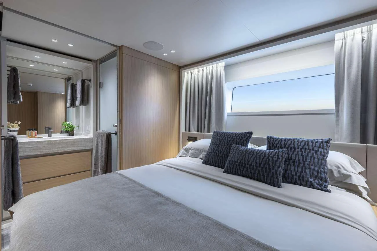 a bed with white sheets aboard FATSA Yacht for Sale