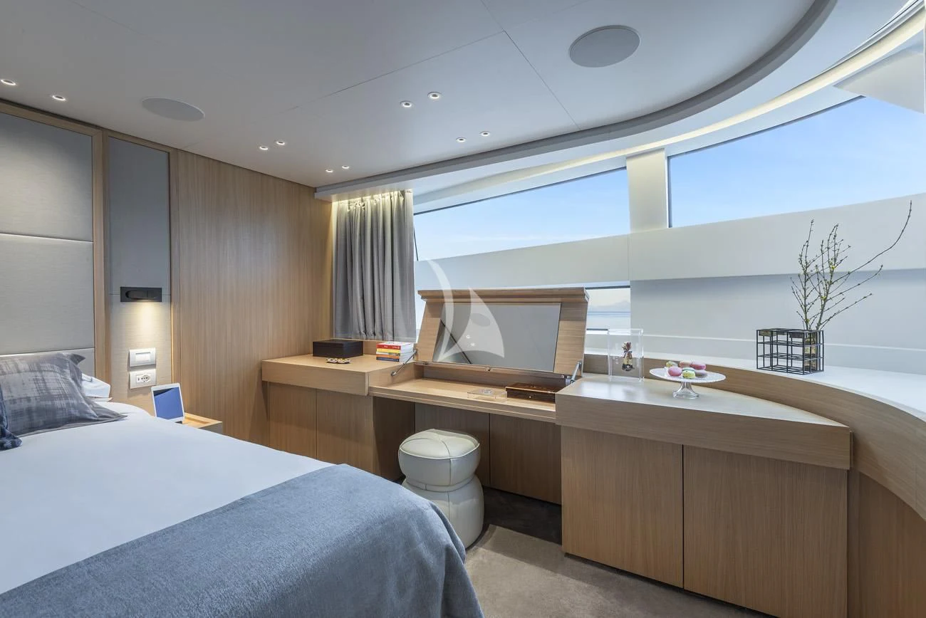 a room with a bed and desk aboard FATSA Yacht for Sale