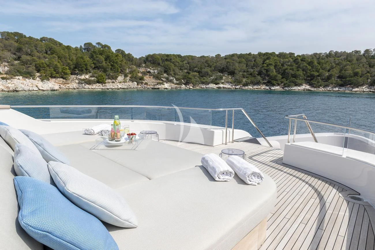a table with a bottle on it by a body of water aboard FATSA Yacht for Sale