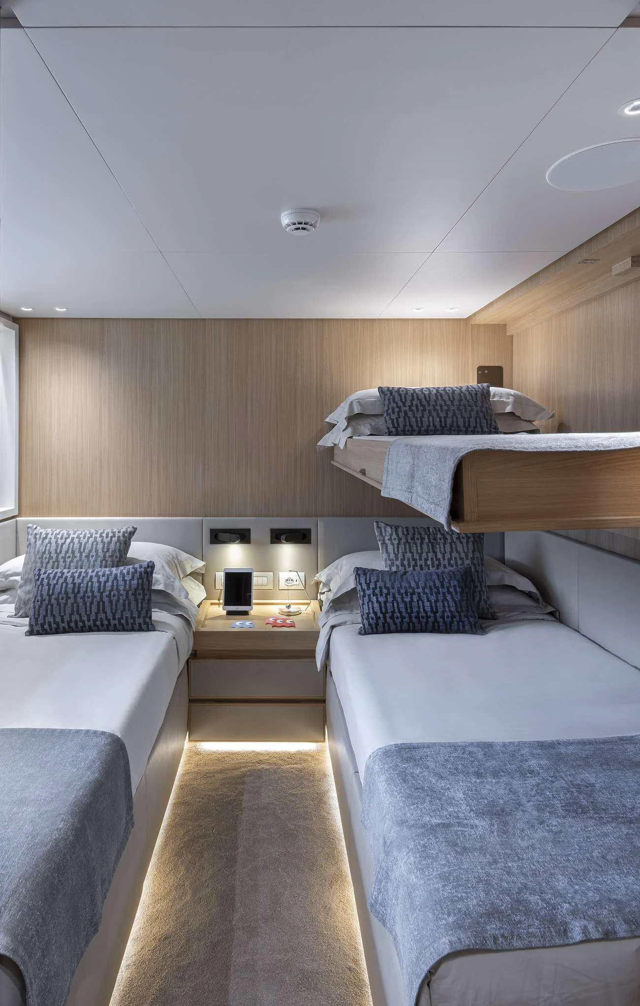 a room with beds and a table aboard FATSA Yacht for Sale