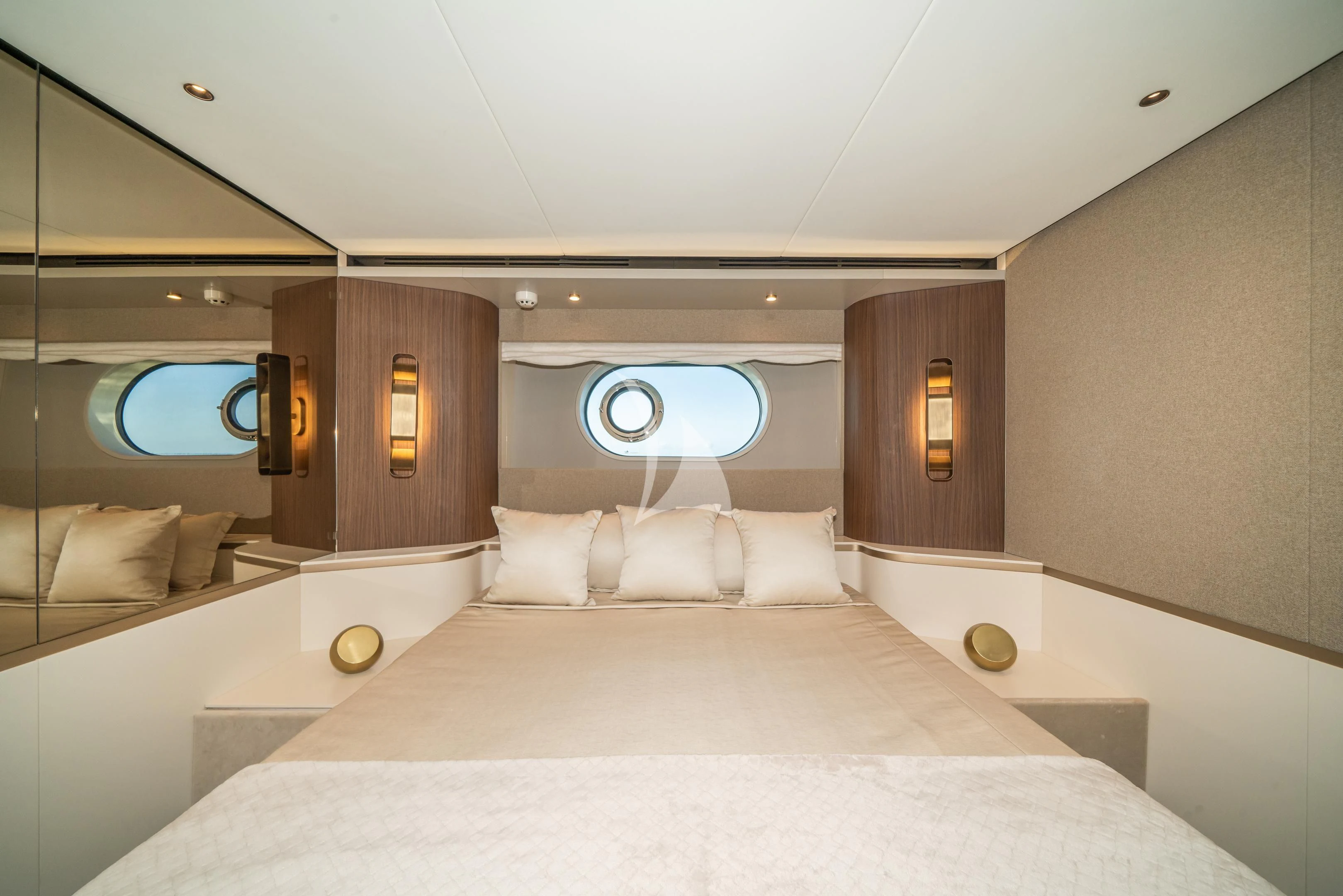 a room with a bed and a large mirror aboard GUBA TIMES Yacht for Charter