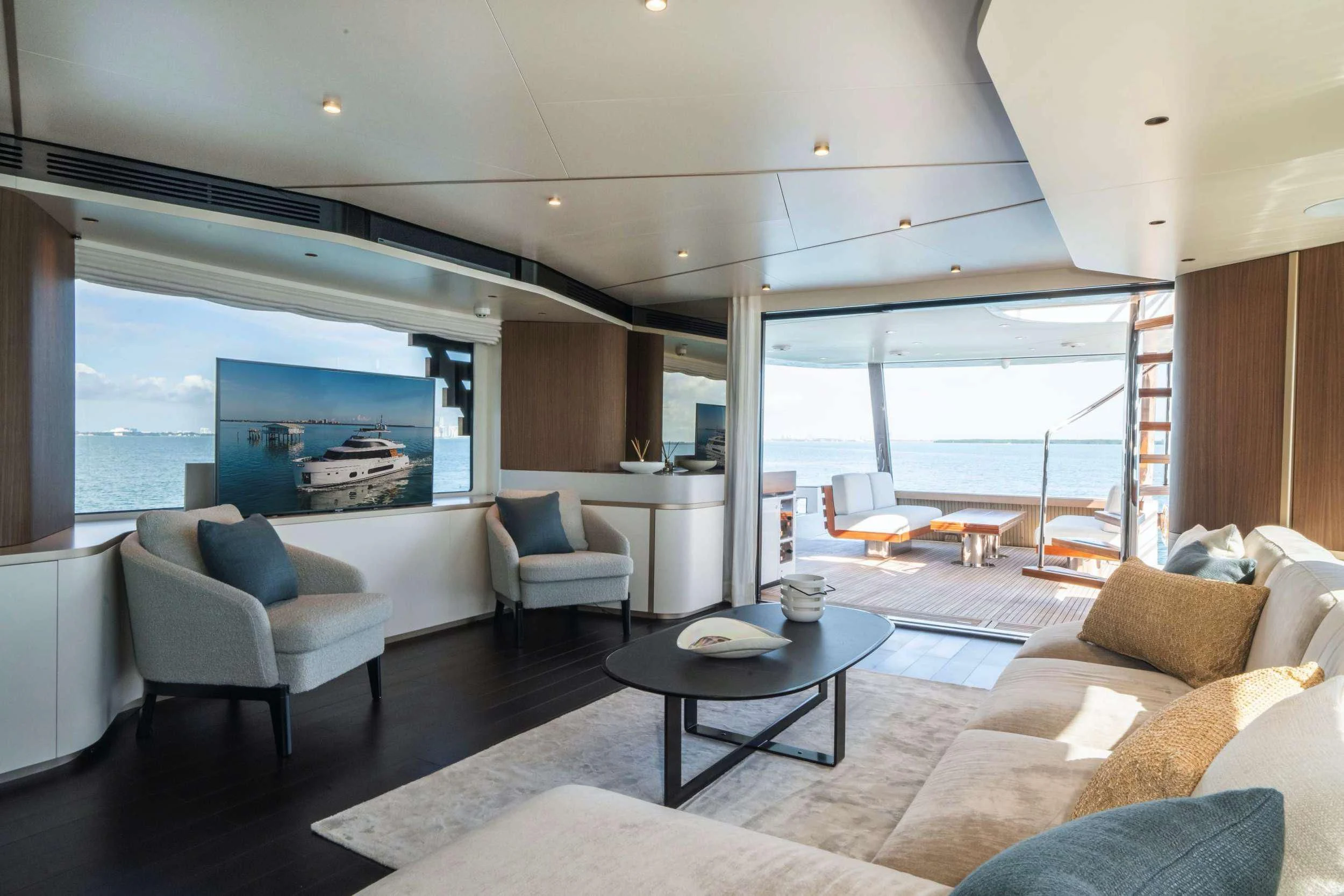 a living room with a large window aboard GUBA TIMES Yacht for Charter