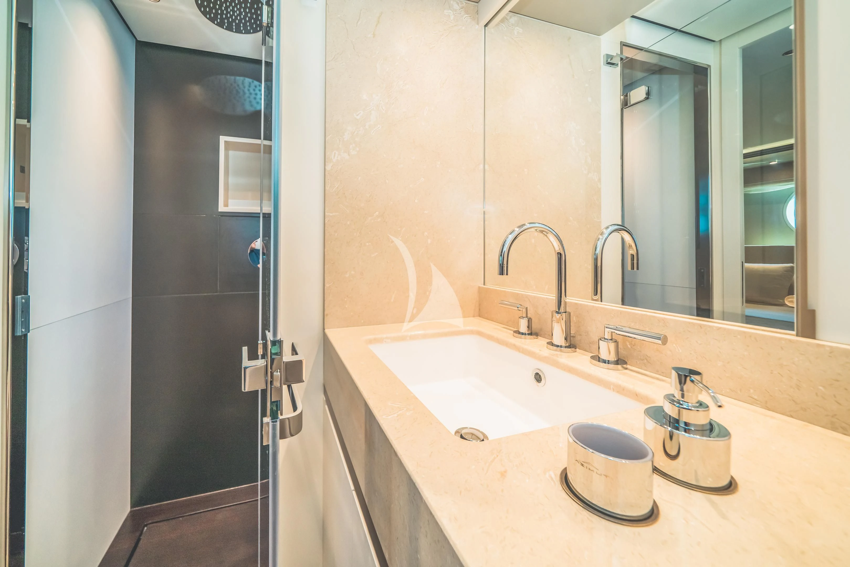 a bathroom with a sink and mirror aboard GUBA TIMES Yacht for Charter